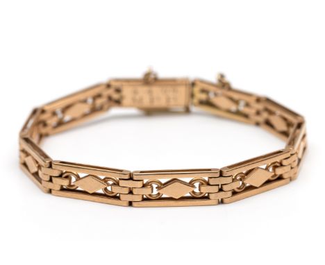 14 kt. Roségouden armband, opgebouwd uit rechthoekige open schakels, elk met twee cirkels en een ruit. Een schakel los, de bi