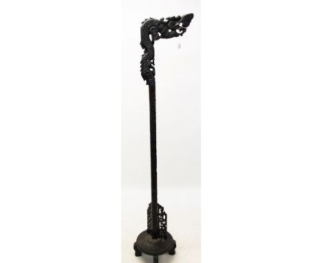 Antique Chinese carved hardwood standard lamp with dragon support on circular base and block feet, 195cm high