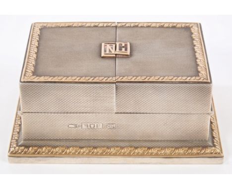 Early George V silver playing card box with engine-turned decoration and gold foliate borders, hinged double cover with appli