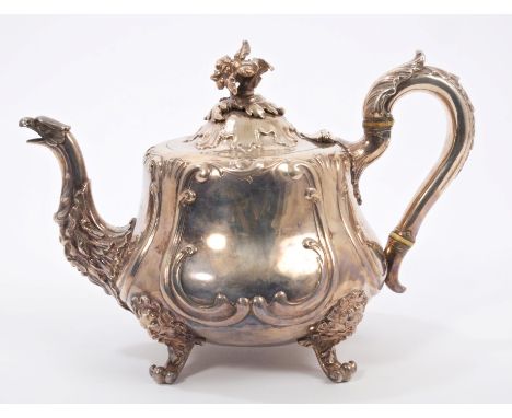 Victorian silver teapot of baluster form, with raised scroll decoration, Satyr mask and eagle's head spout, silver scroll han