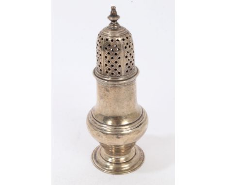 Late George II silver caster of plain baluster form, with detachable pierced slip-in cover with urn finial on circular domed 