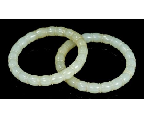 Two antique Chinese carved jade bangles with segmented design, approximately 76mm diameter CONDITION REPORT Both in good cond