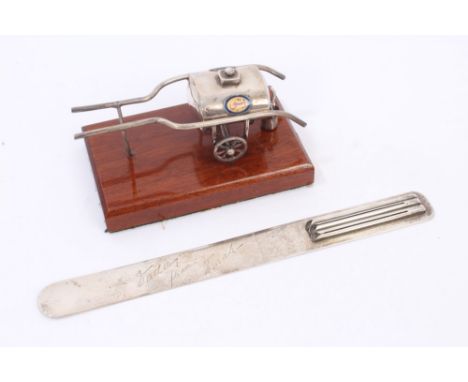 Egyptian silver model of an 'Esso' petrol bowser in a two-wheeled frame, with separate bucket mounted on a mahogany plinth (b