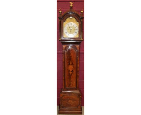 19th century longcase clock with eight day musical movement on eight bells, 12 inch break arch dial with face mask and foliat