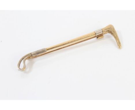 Good quality gold (14ct) brooch in the form of a hunting whip, with textured handle, 5.5cm long, in box CONDITION REPORT Tota