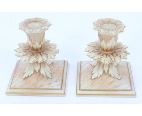 Pair late Victorian Graingers Worcester blushed ivory candlesticks with leaf moulded and marbled decoration, on square bases 