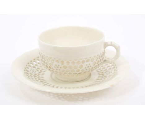 Victorian Royal Worcester reticulated cup and saucer - left in the white, the cup with moulded bamboo handle and cagework pan
