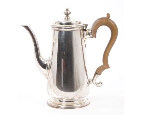 1920s silver coffee pot of tapering form, in the Georgian style, with long spout and fruitwood scroll handle, hinged domed co