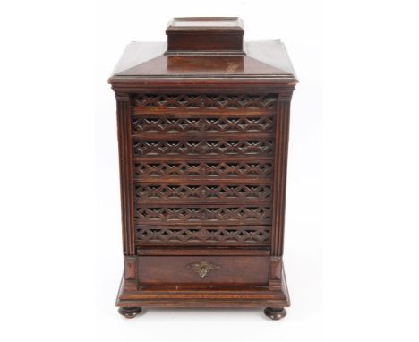 Rare Victorian mahogany cigar cabinet of architectural form, surmounted by a hinged vesta compartment and slightly domed top,