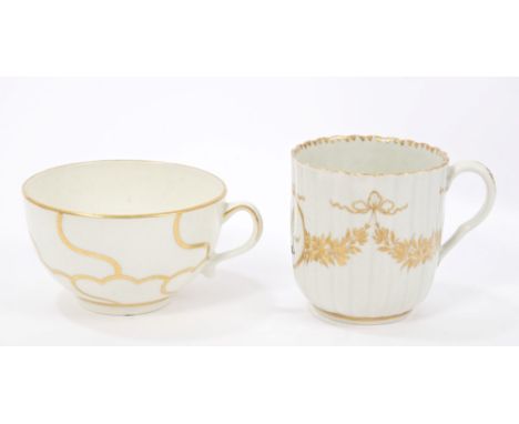 18th century Worcester gilt fluted armorial coffee cup with griffin crest and gilt floral swags and Worcester gilt decorated 