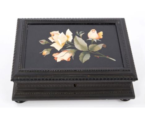 Late 19th / early 20th century Continental ebonised and pietra dura box, the hinged lid with inlaid hardstone panel of roses,