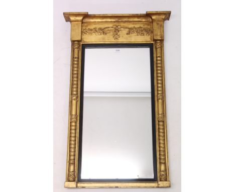 Regency gilt gesso pier mirror, rectangular plate within ebonised slip and table frieze with flanking split bobbin-turned col