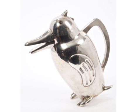 Unusual 1920s / 1930s Chinese white metal decanter in the form of a stylised penguin with black hardstone eyes, angular silve