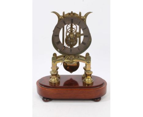 Early 20th century skeleton clock with single chain-driven fusee timepiece movement, heavy ornate 'Lyre' plates and silvered 