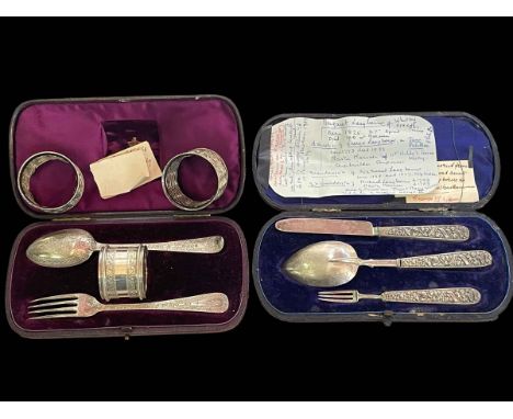 Cased silver christening set, silver fork and spoon, and three napkin rings (one silver).