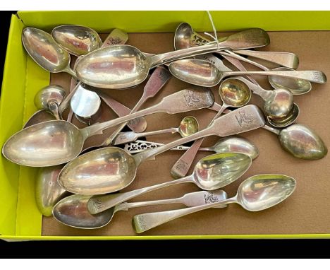 Collection of assorted silver spoons.