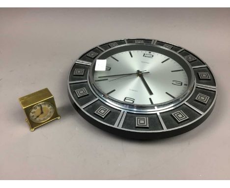 ZENITH BRASS ALARM CLOCK,along with a Metamec wall clock (2)