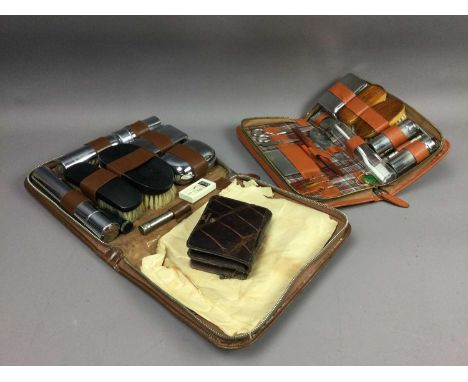 TWO GENTLEMAN'S DRESSING TABLE SETS,cased, along with a crocodile skin wallet (3)Condition report: Dressing sets light intern