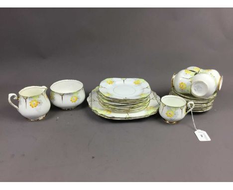 PHOENIX PART TEA SERVICE,comprising 5 cups, 8 saucers, 7 side plates, 2 cake plates, sugar bowl and milk jug