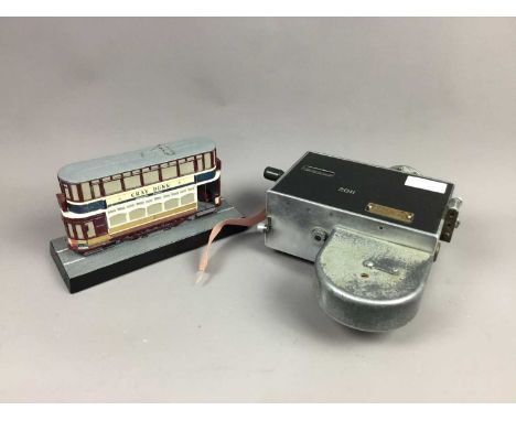 EDINBURGH CORPORATION TRANSPORT TICKET MACHINE,along with a resin model of a Glasgow tram