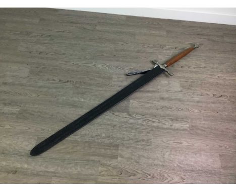 REPRODUCTION CLAYMORE STYLE SWORD,in leather scabbardCondition report: 130cm long