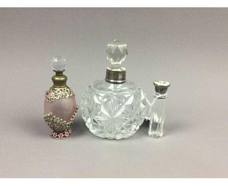 GLASS SCENT BOTTLE,with silver and guilloche enamel cover, along with a silver collared scent bottle, and another (3)
