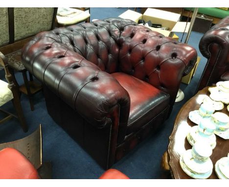 PAIR OF OXBLOOD LEATHER CHESTERFIELD BUTTONED ARMCHAIRSCondition report: Rip to the bottom of one seat cushion lining. One ar