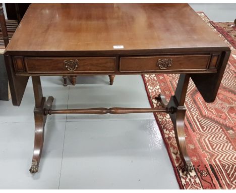 Regency style Mahogany Sofa Table with two apron drawers, on 4 splayed legs, brass toes and castors, 33”d, extends to 55”w, 2