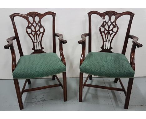 Matching set of 8 mahogany chair carvers, in the Chippendale style with slat backs, curved arms, square legs, green padded se