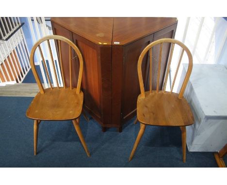 Two teak corner cabinets and a pair of stick back chairs