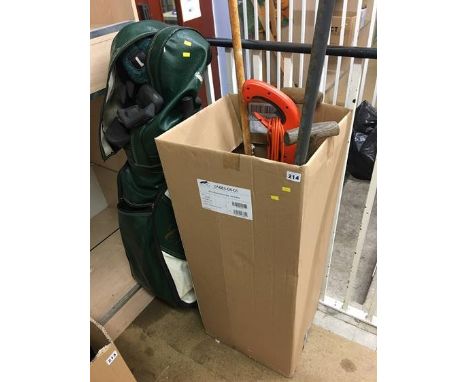 Golf club and assorted gardening tools