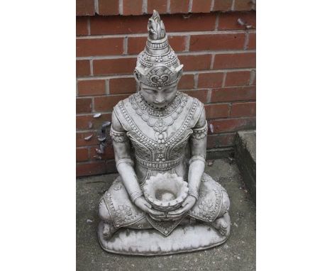 A garden statue of Buddha