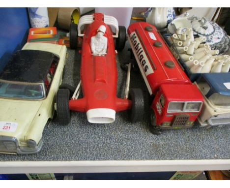 TIN PLATE MOBIL GAS CONTAINER, A VINTAGE TIN PLATE CAR, A TIN PLATE MILK FLOAT AND A RACING CAR (4) 