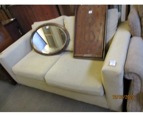 CREAM UPHOLSTERED TWO SEATER SOFA BED 