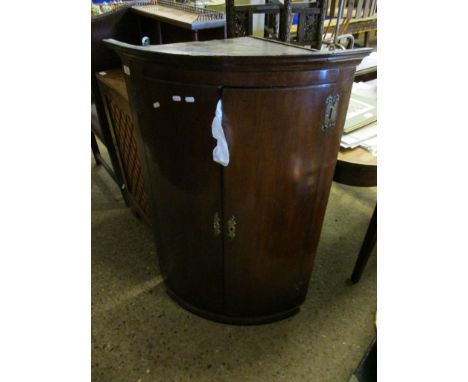 18TH CENTURY MAHOGANY BOW FRONTED WALL HANGING CORNER CUPBOARD WITH TWO CUPBOARD DOORS AND BRASS HINGES 