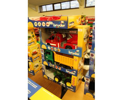 Bruder John Deere tractor, fire truck, tipping truck and furrow