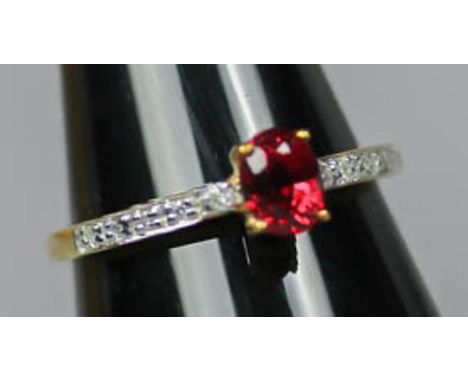 A 9ct yellow gold, ruby and white stone ring, the oval ruby approx 0.25ct, ring size O Good condition