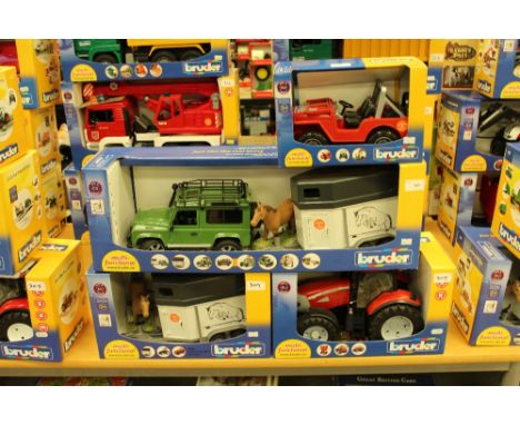 Bruder Land rover and Jeeps with horse boxes and McCormick tractor
