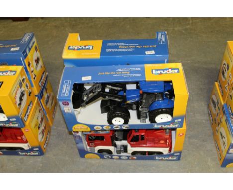 Bruder New Holland tractor, logging trailer and 2 fire trucks