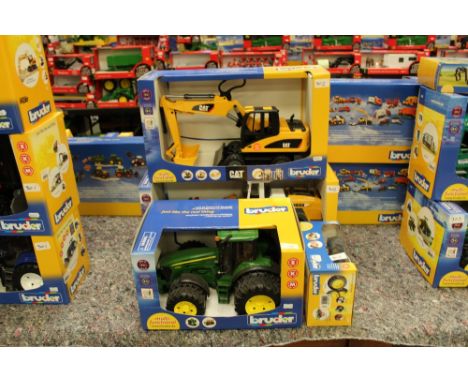 Bruder John Deere tractor, CAT digger and Liebherr loader and spare wheels