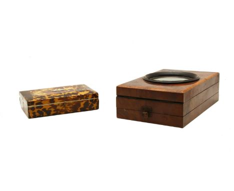 A tortoiseshell jewellery box, 15cm x 10cm, together with an Edwardian yew wood table top magnifier, 22cm x 14cm (2)Condition