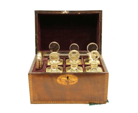 A Regency mahogany decanter box, with neo-classical conch shell inlay to the lid and chequer line border stringing, enclosing