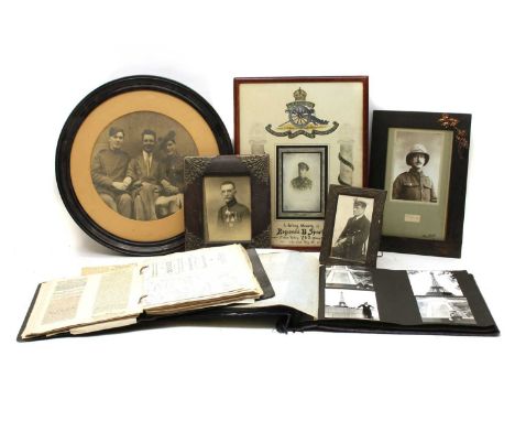 A quantity of framed WWI photographs of soldiers and fretwork search light scene, posthumous memorial photo of Royal Artiller