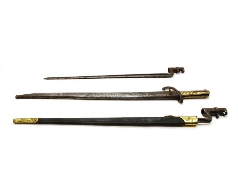 Three bayonets, comprising: two Martini Henry type sockets, one with a brass mounted leather scabbard, and a French Chassepot