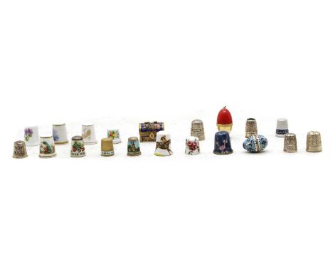 A collection of silver, brass, bakelite, porcelain and enamel thimbles, including a silver example by Charles Horner and an A