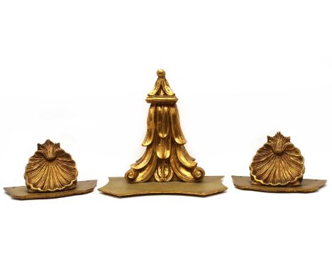 A pair of giltwood shell form wall brackets, 30cm wide, 16cm high, together with one other wall bracket with carved support, 