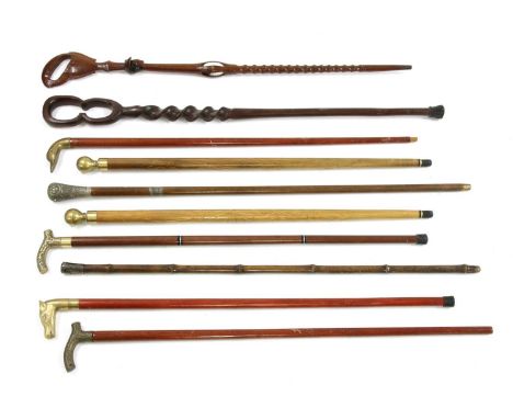 A collection of Far Eastern walking sticks, to include a sword stick and two novelty sticks with screw tops revealing snooker