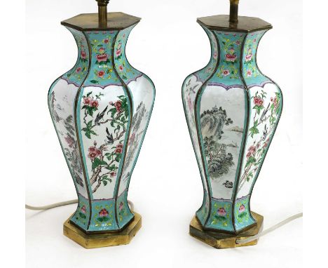 A pair of Chinese Canton enamelled table lamps and shades,early 20th century, the vases of hexagonal baluster shape on metal 