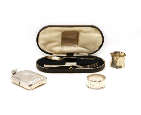 A cased silver three piece christening set, Sheffield 1935, together with a small silver spirit flask, Sheffield 1922, and a 