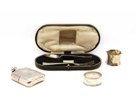 A cased silver three piece christening set, Sheffield 1935, together with a small silver spirit flask, Sheffield 1922, and a 